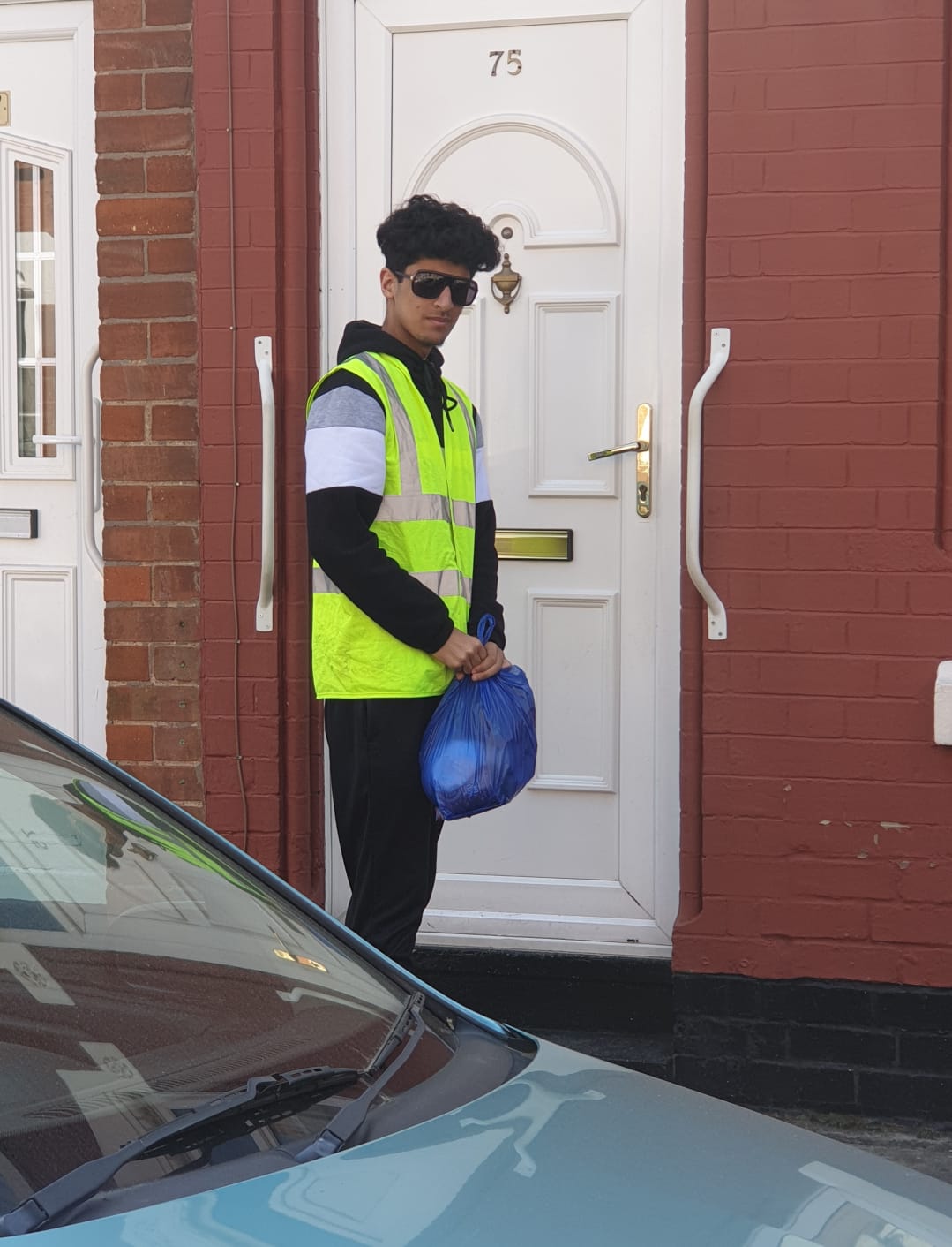 One of our young volunteers who have been helping to deliver parcels in these difficult times.